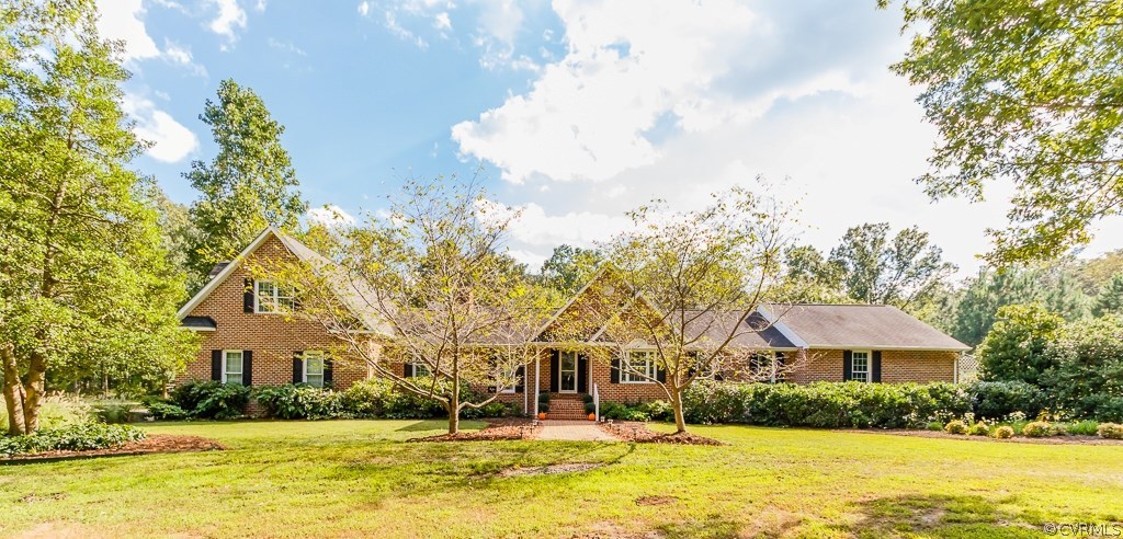 8485 Stumpy Road Hanover, VA 23069 - Photo 1 of 50 a front view of house with yard and trees