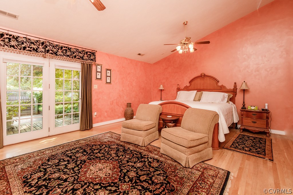 8485 Stumpy Road Hanover, VA 23069 - Photo 16 of 50 a bedroom with a bed lamp and a large window with outer view