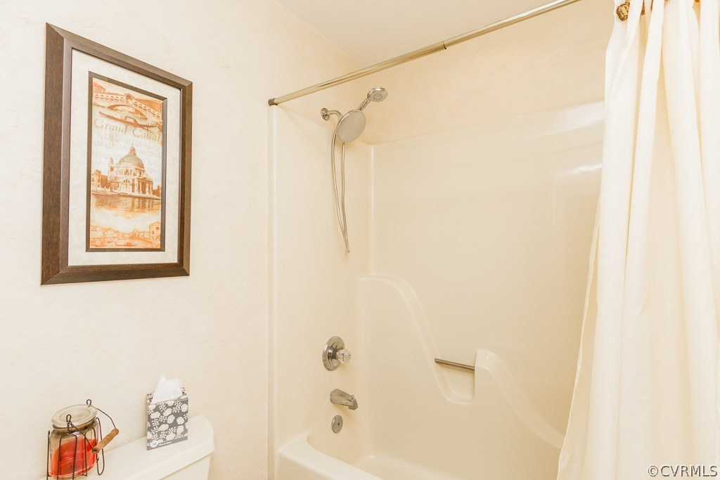 8485 Stumpy Road Hanover, VA 23069 - Photo 23 of 50 a bathroom with a shower and a tub