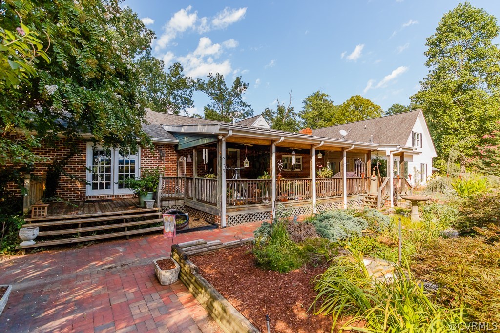 8485 Stumpy Road Hanover, VA 23069 - Photo 38 of 50 a front view of a house with a garden