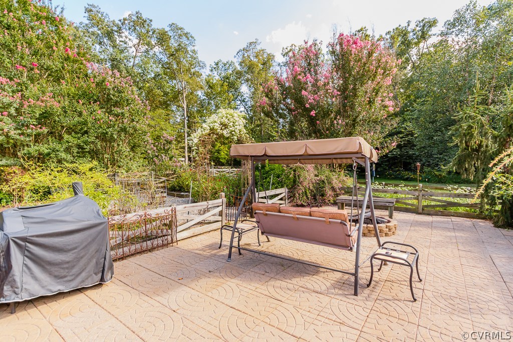 8485 Stumpy Road Hanover, VA 23069 - Photo 44 of 50 a backyard of a house with table and chairs