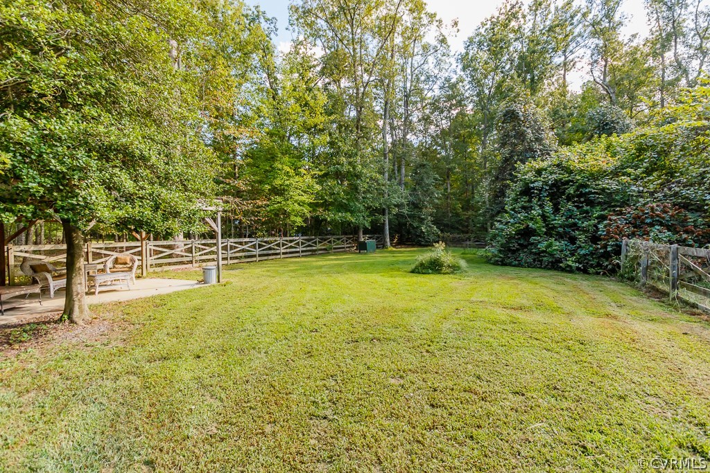 8485 Stumpy Road Hanover, VA 23069 - Photo 49 of 50 a view of a swimming pool with an outdoor seating and a yard