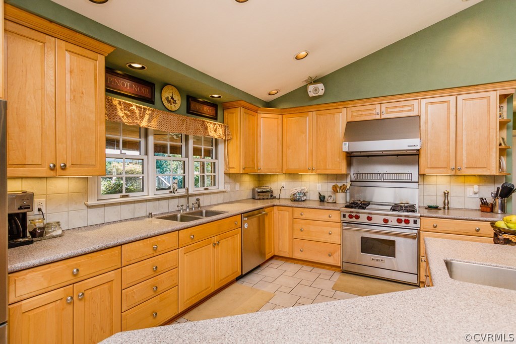 8485 Stumpy Road Hanover, VA 23069 - Photo 9 of 50 a kitchen with stainless steel appliances a stove sink and cabinets