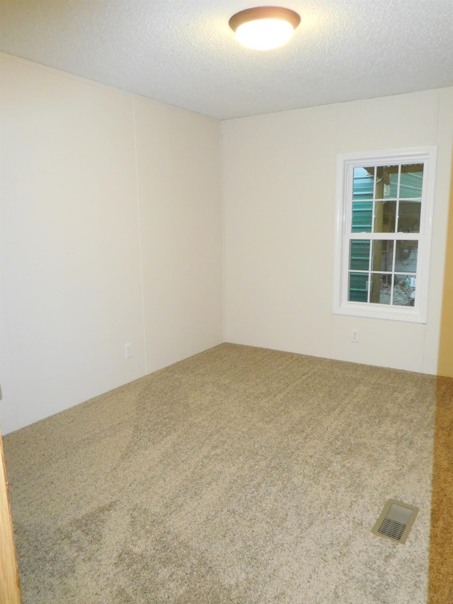 1032 Kaity Brooke Road Portland, TN 37148 - Photo 13 of 23 Bedroom 2 also new carpet and window