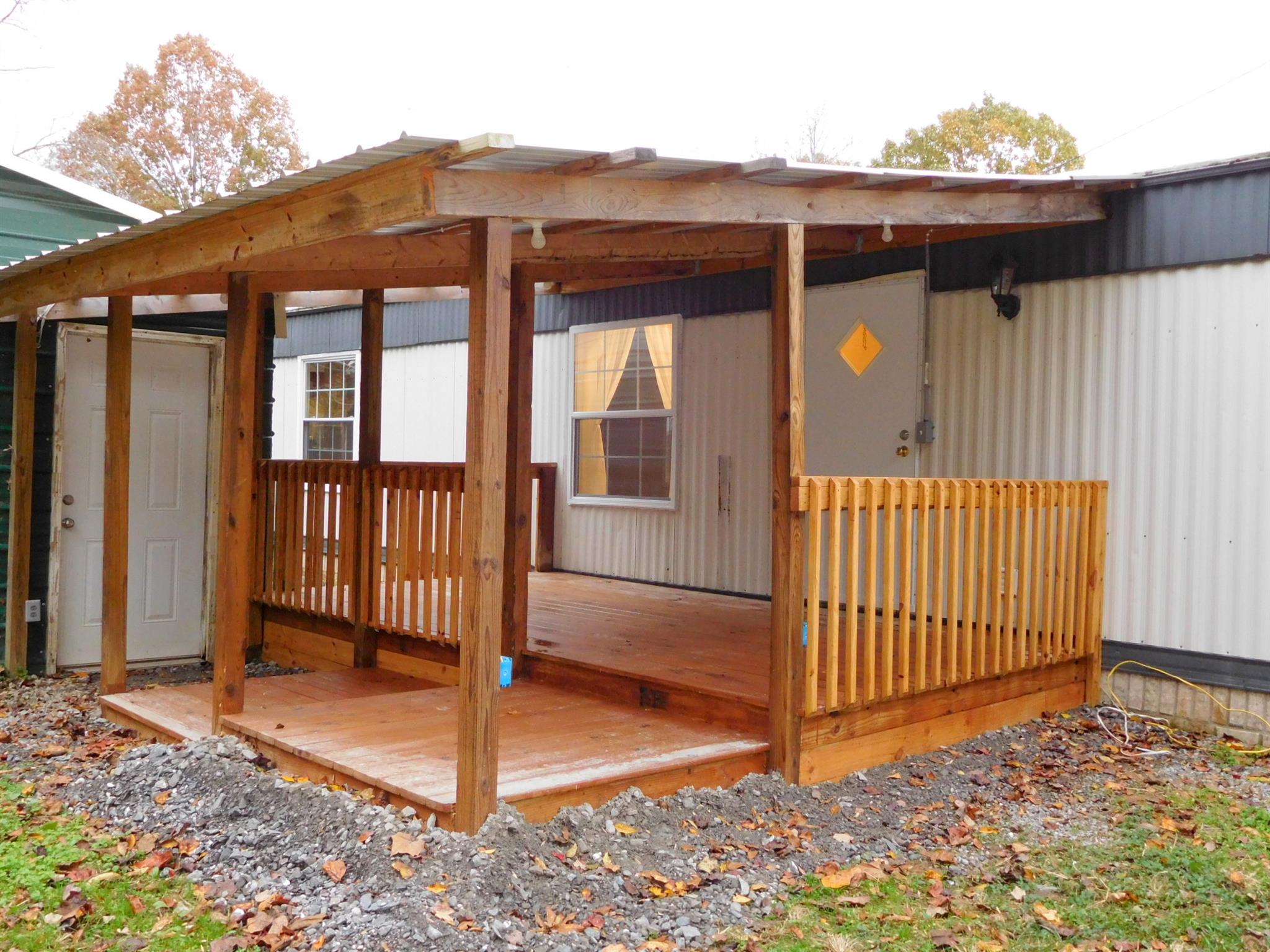 1032 Kaity Brooke Road Portland, TN 37148 - Photo 20 of 23 View of back deck -(carport to left is being removed)