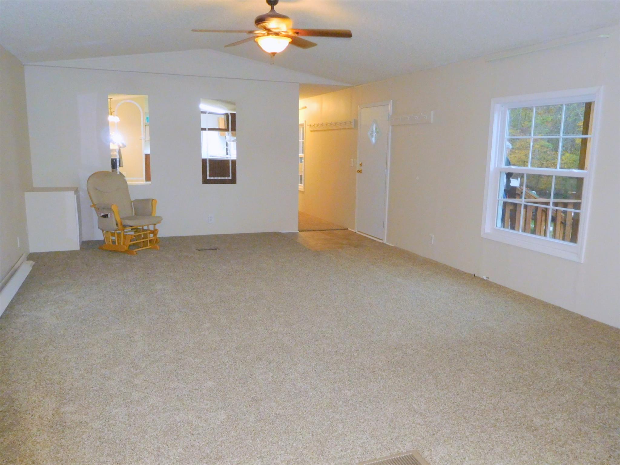 1032 Kaity Brooke Road Portland, TN 37148 - Photo 6 of 23 View of living room from kitchen. New windows, paint and carpet!