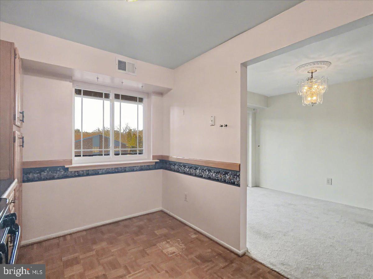 1575 Creekside Road, Unit A21 Whitehall, PA 18052 - Photo 13 of 21 a view of a kitchen with a sink and windows