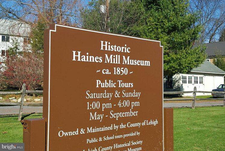 1575 Creekside Road, Unit A21 Whitehall, PA 18052 - Photo 20 of 21 a view of outdoor space with a garden and bench