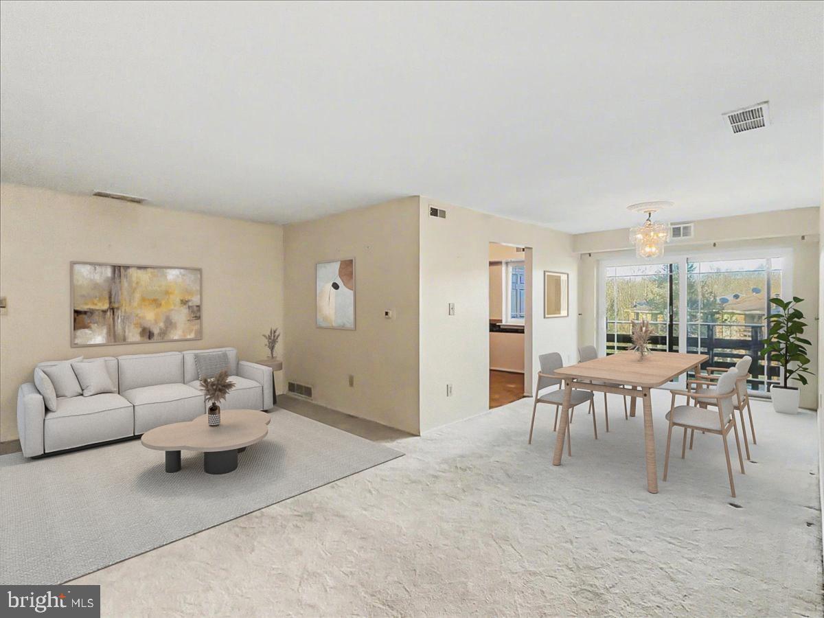 1575 Creekside Road, Unit A21 Whitehall, PA 18052 - Photo 2 of 21 a living room with furniture a dining table and a fireplace