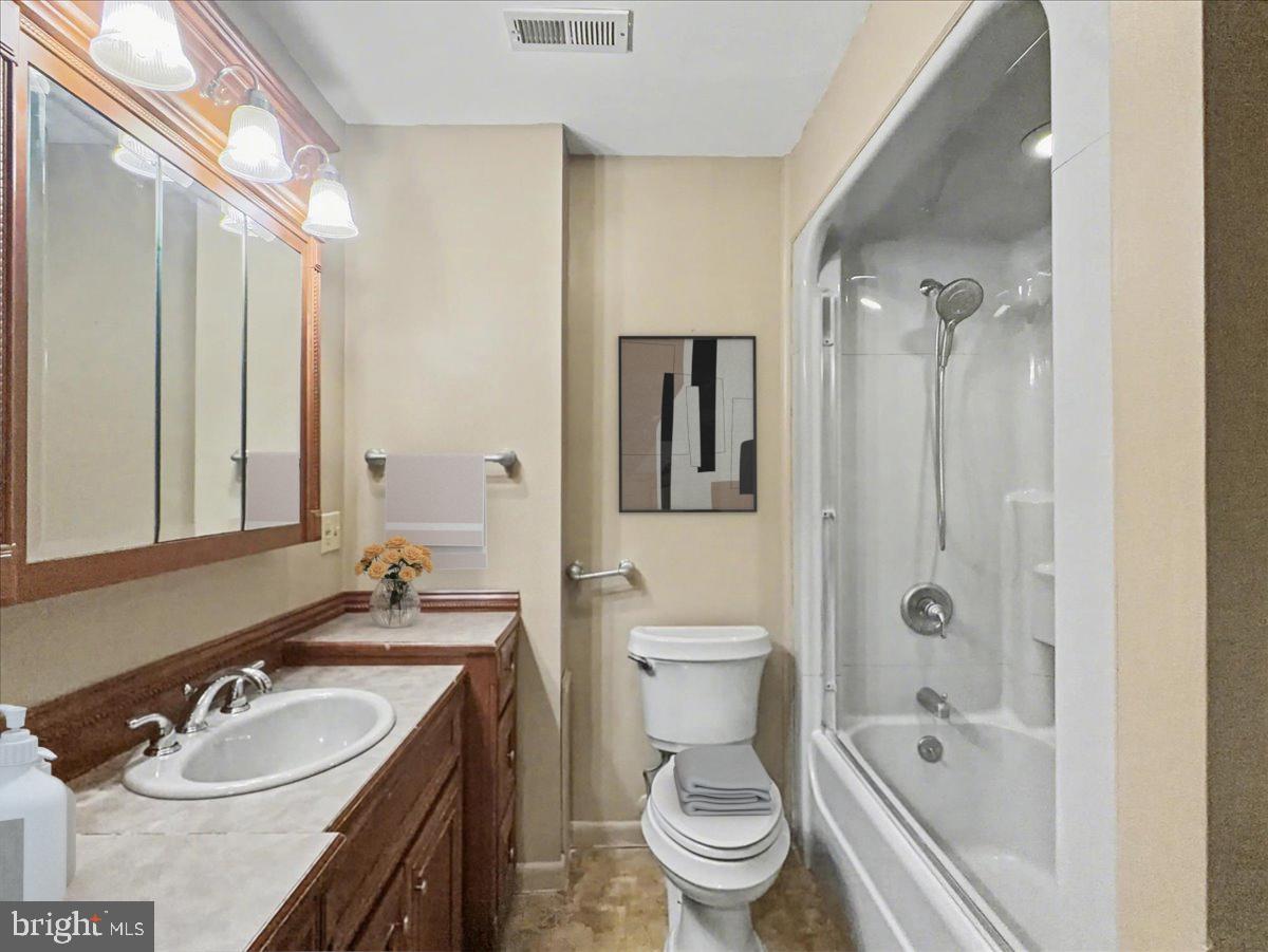 1575 Creekside Road, Unit A21 Whitehall, PA 18052 - Photo 7 of 21 a bathroom with a sink a toilet and shower