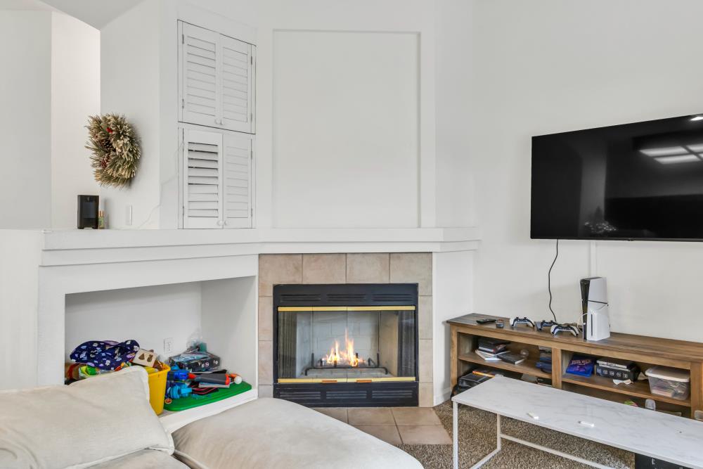 8679 Spring House Way Elk Grove, CA 95624 - Photo 13 of 48 a living room with furniture and a fireplace