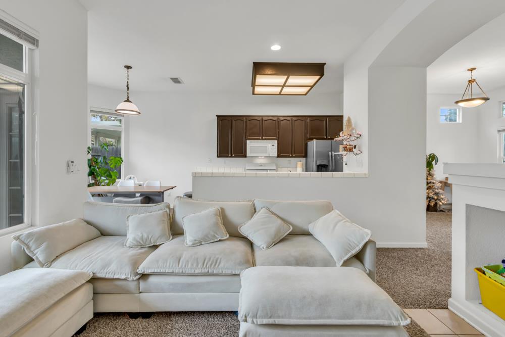 8679 Spring House Way Elk Grove, CA 95624 - Photo 14 of 48 a living room with furniture and a fireplace