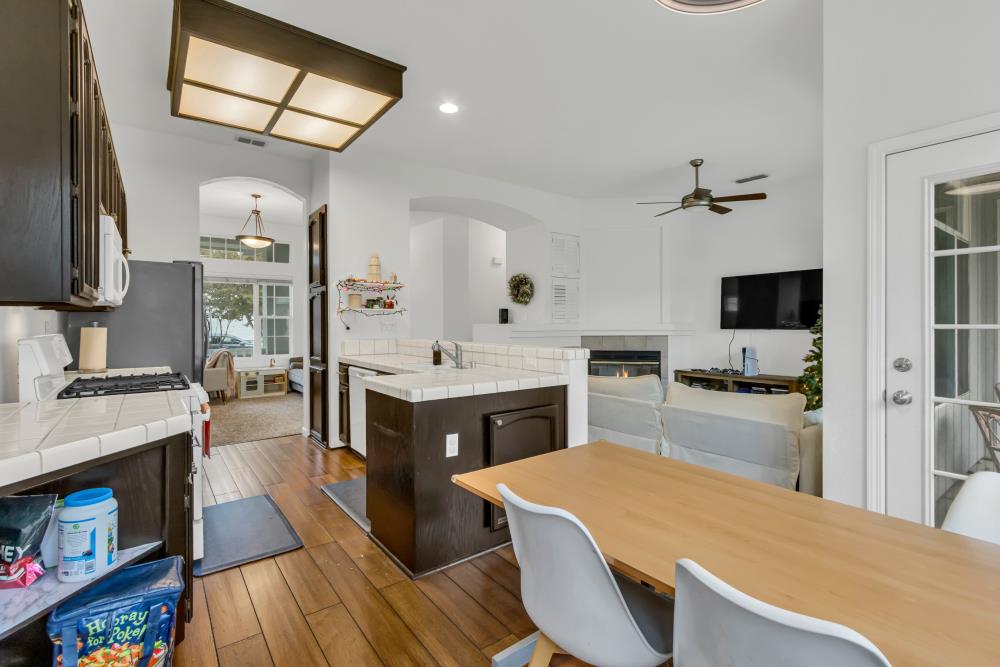 8679 Spring House Way Elk Grove, CA 95624 - Photo 16 of 48 a large kitchen with cabinets a counter top space a sink stainless steel appliances and cabinets