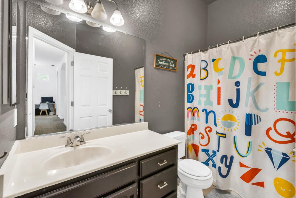 8679 Spring House Way Elk Grove, CA 95624 - Photo 29 of 48 a bathroom with a sink and a mirror