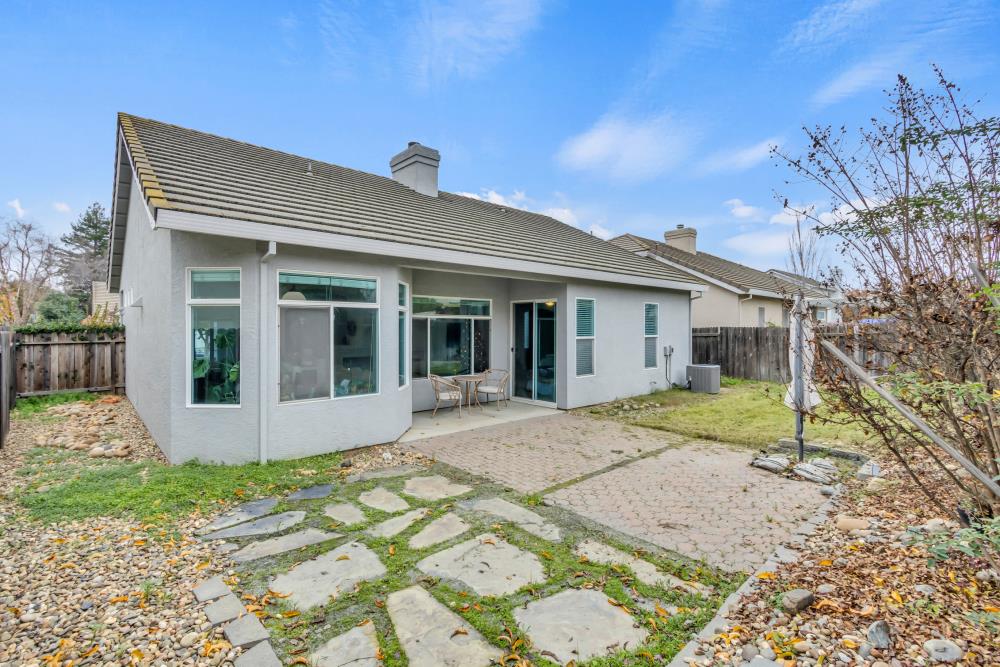 8679 Spring House Way Elk Grove, CA 95624 - Photo 39 of 48 front view of a house with a yard
