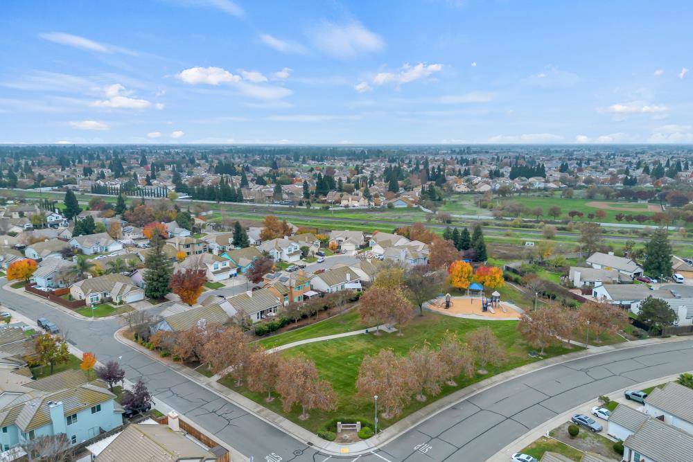 8679 Spring House Way Elk Grove, CA 95624 - Photo 46 of 48 a view of a lake with a city