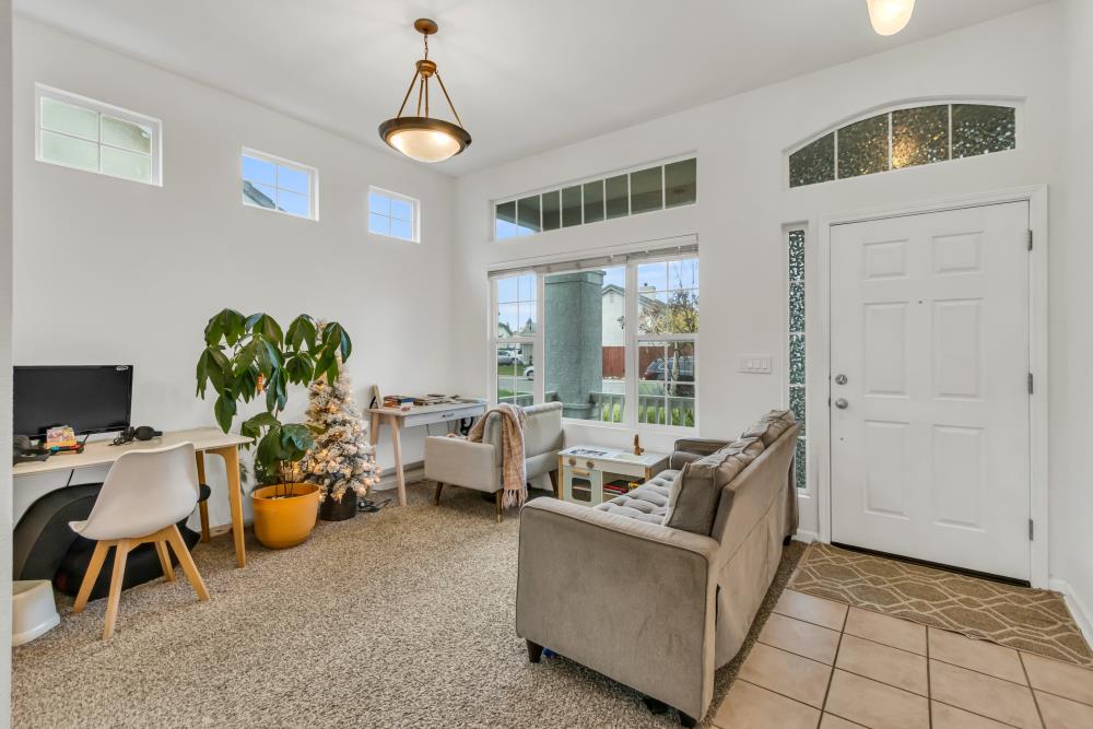 8679 Spring House Way Elk Grove, CA 95624 - Photo 8 of 48 a living room with furniture and a window