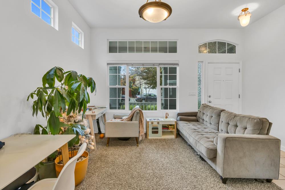 8679 Spring House Way Elk Grove, CA 95624 - Photo 9 of 48 a living room with furniture and a potted plant