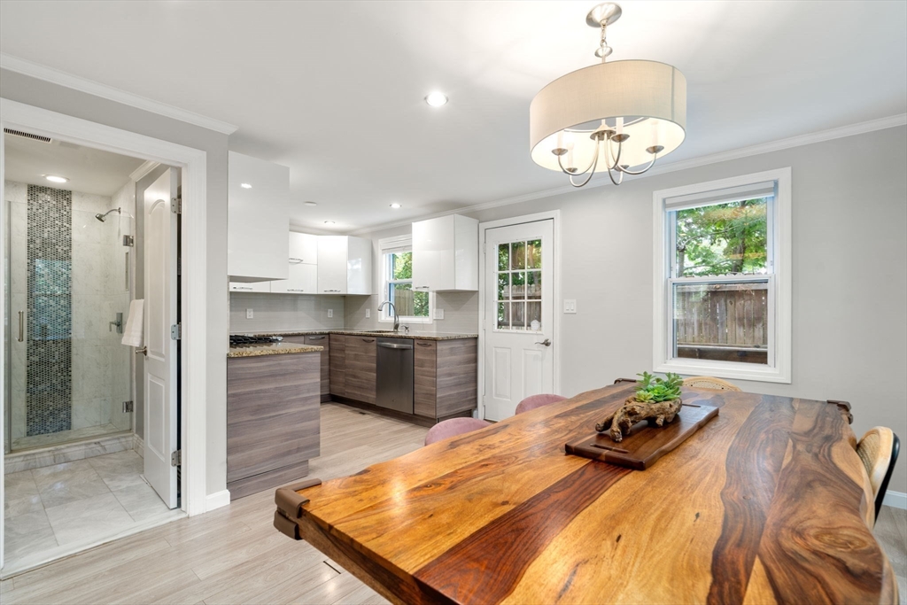 149 Bolivar Street, Unit C6 Canton, MA 02021 - Photo 14 of 41 a bed room with a bed mirror furniture and a window