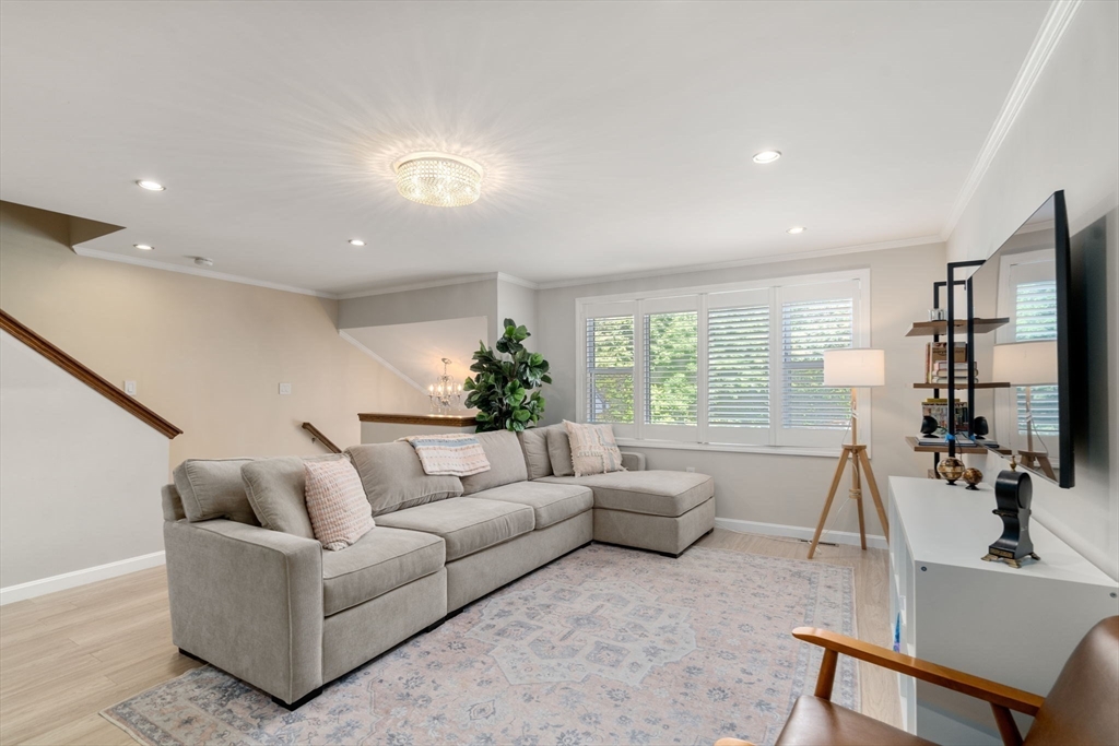 149 Bolivar Street, Unit C6 Canton, MA 02021 - Photo 16 of 41 a living room with furniture a window and a flat screen tv
