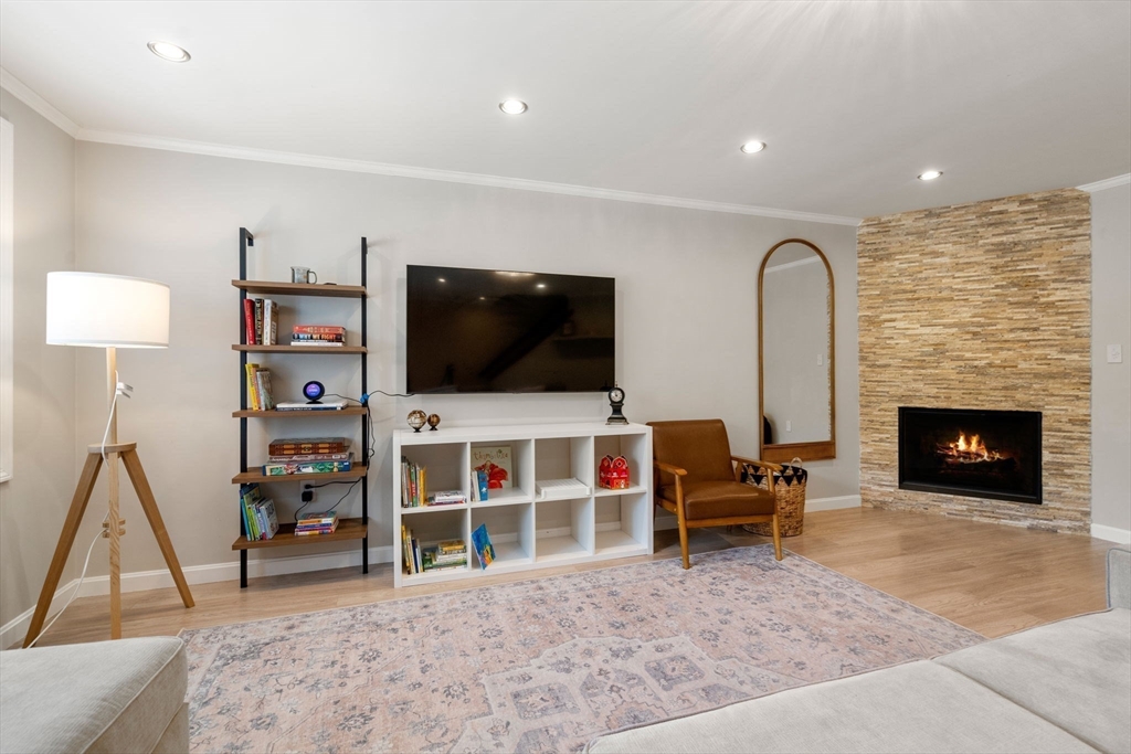 149 Bolivar Street, Unit C6 Canton, MA 02021 - Photo 18 of 41 a living room with a flat screen tv and a fireplace