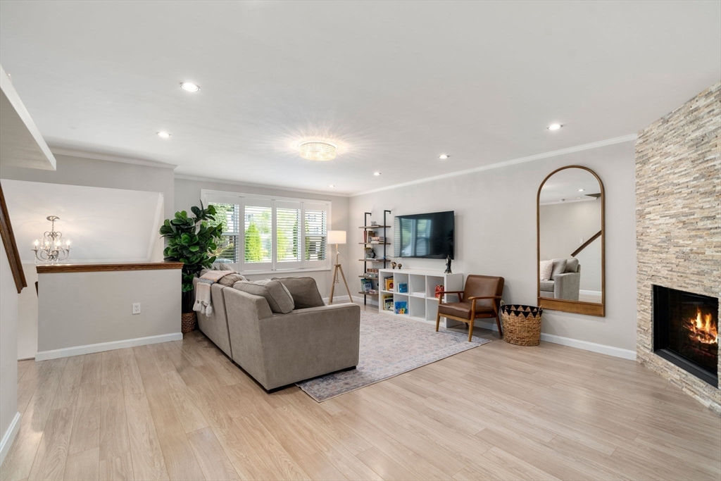 149 Bolivar Street, Unit C6 Canton, MA 02021 - Photo 19 of 41 a living room with furniture and a fireplace