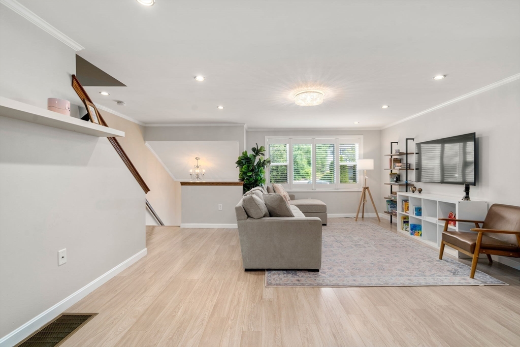 149 Bolivar Street, Unit C6 Canton, MA 02021 - Photo 20 of 41 a living room with furniture and a wooden floor