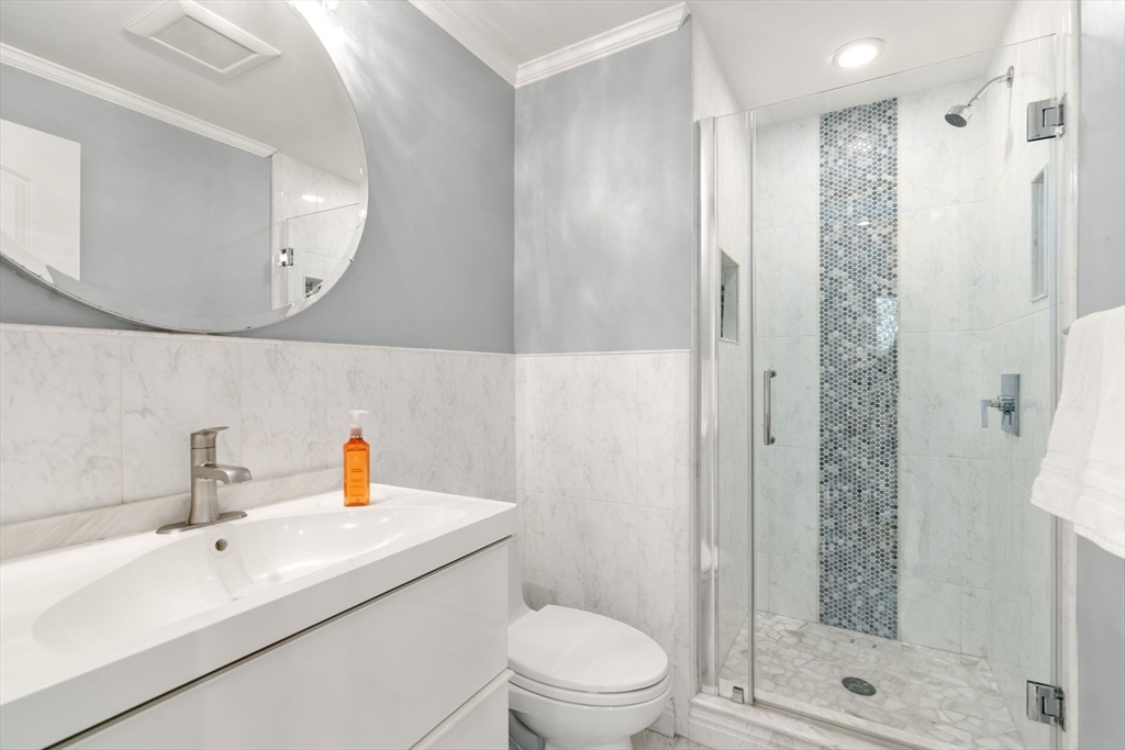 149 Bolivar Street, Unit C6 Canton, MA 02021 - Photo 21 of 41 a bathroom with a sink a toilet and shower