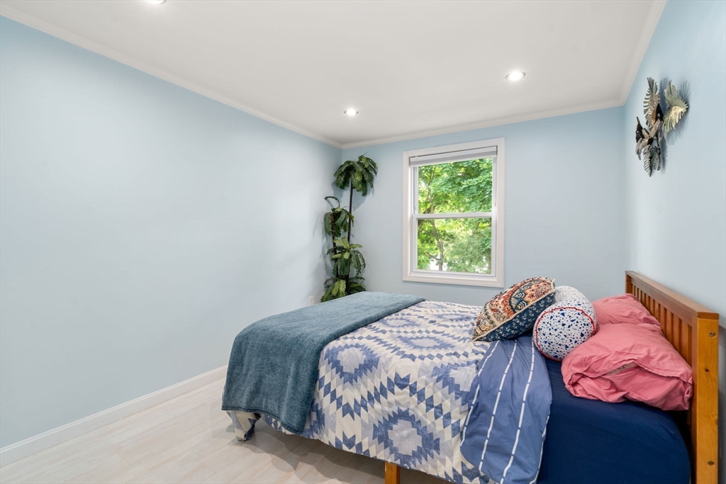 149 Bolivar Street, Unit C6 Canton, MA 02021 - Photo 27 of 41 a bedroom with a bed and a window