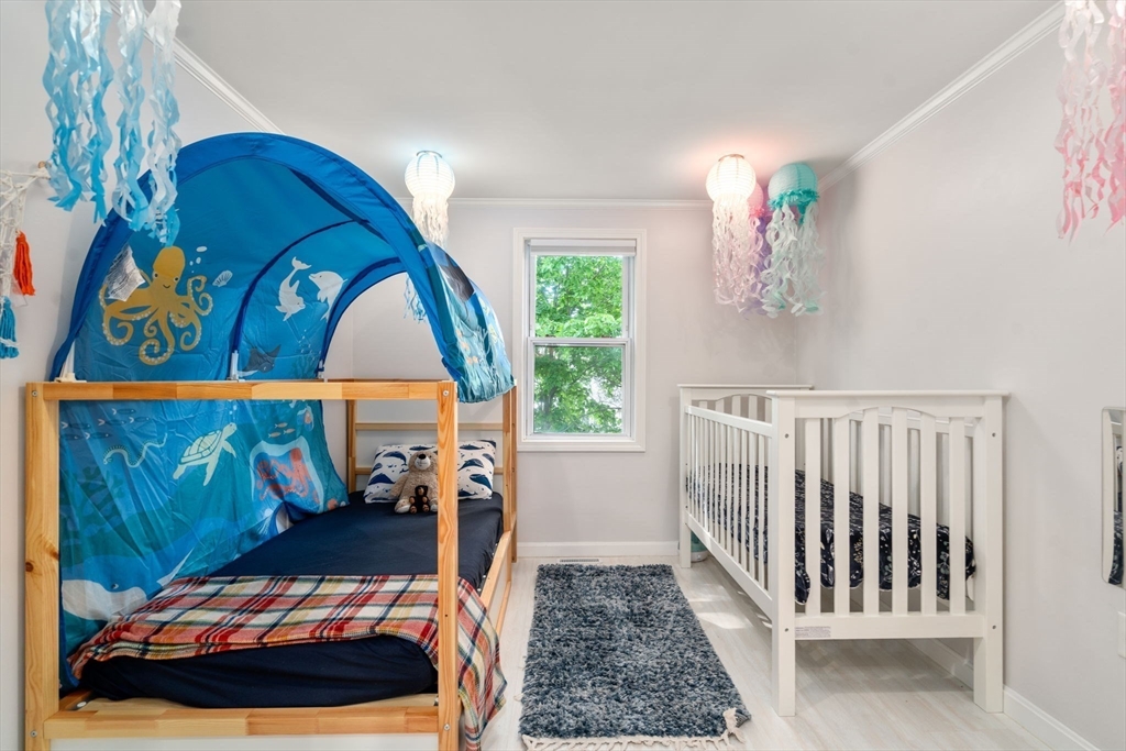 149 Bolivar Street, Unit C6 Canton, MA 02021 - Photo 29 of 41 a bedroom with a bed and a window