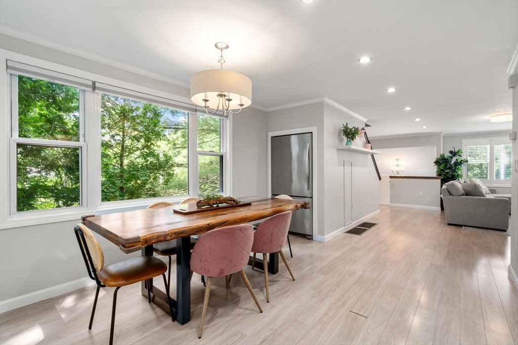 149 Bolivar Street, Unit C6 Canton, MA 02021 - Photo 3 of 41 a view of a dining room with furniture window and wooden floor