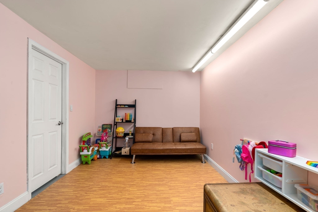 149 Bolivar Street, Unit C6 Canton, MA 02021 - Photo 33 of 41 a living room with furniture and a wooden floor