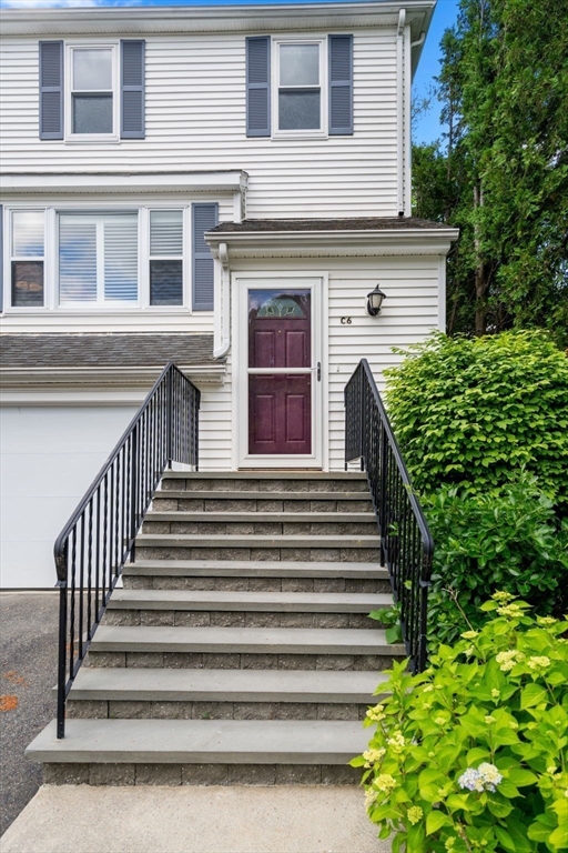 149 Bolivar Street, Unit C6 Canton, MA 02021 - Photo 38 of 41 a view of a house with more windows and flower plants