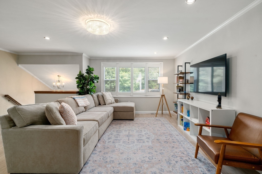 149 Bolivar Street, Unit C6 Canton, MA 02021 - Photo 40 of 41 a living room with furniture and a flat screen tv