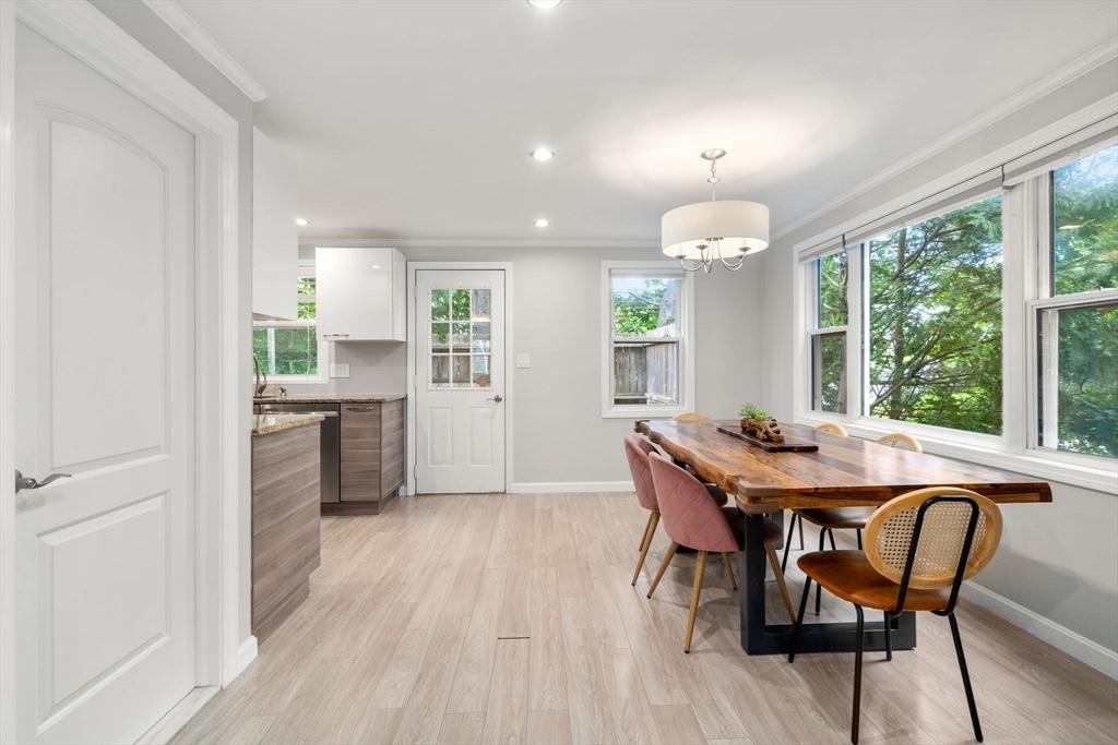 149 Bolivar Street, Unit C6 Canton, MA 02021 - Photo 4 of 41 a view of a dining room with furniture window and wooden floor