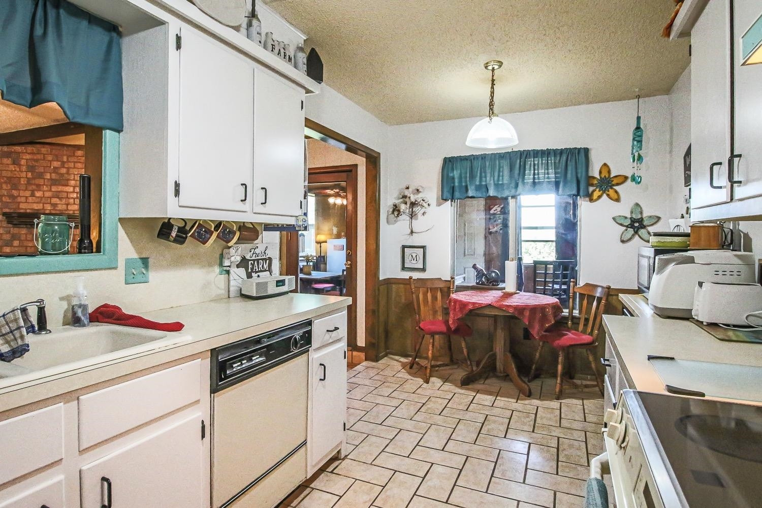 1609 Ave I Ralls, TX 79357 - Photo 13 of 32 a kitchen with a sink appliances and cabinets