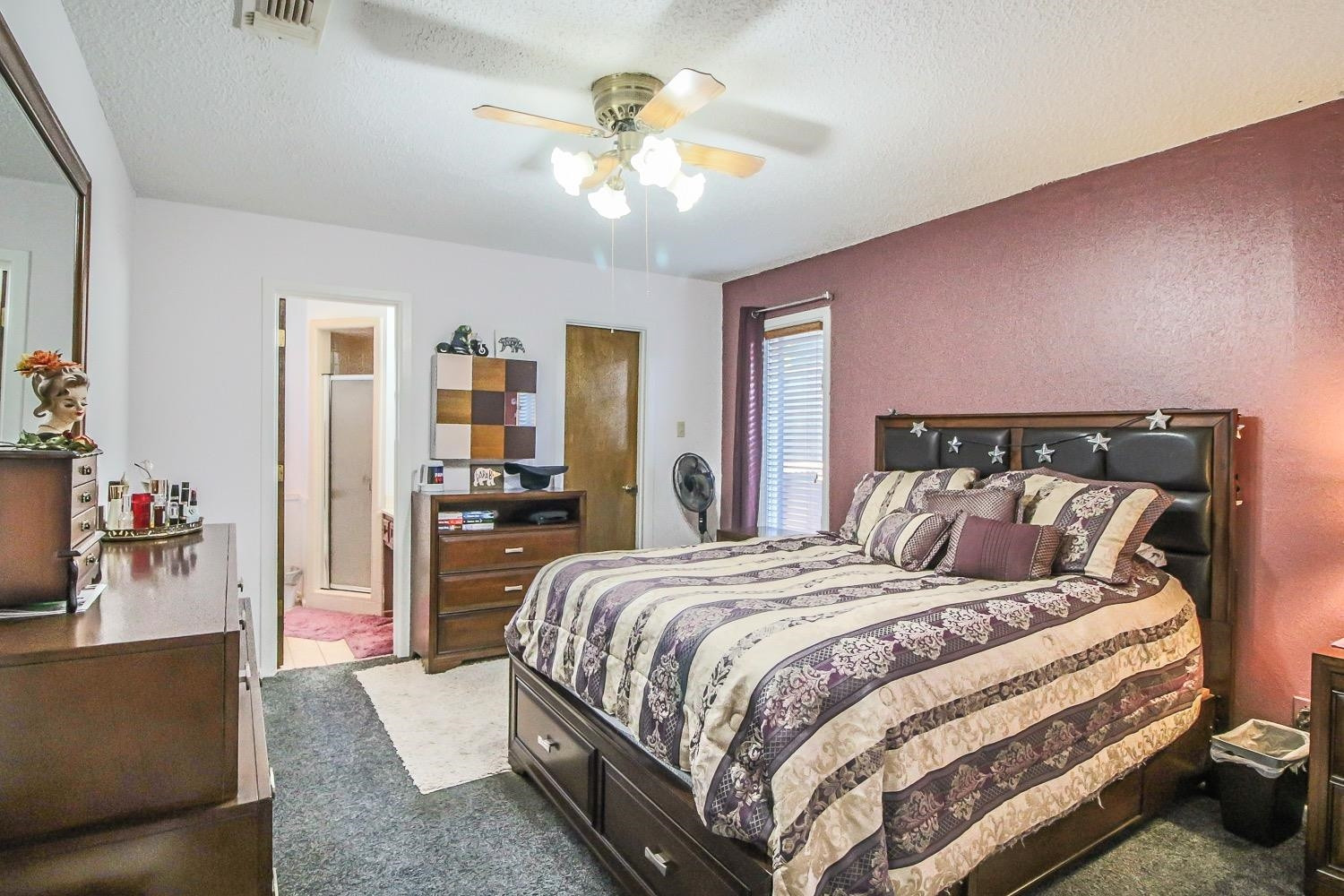1609 Ave I Ralls, TX 79357 - Photo 14 of 32 a bedroom with a bed and ceiling fan