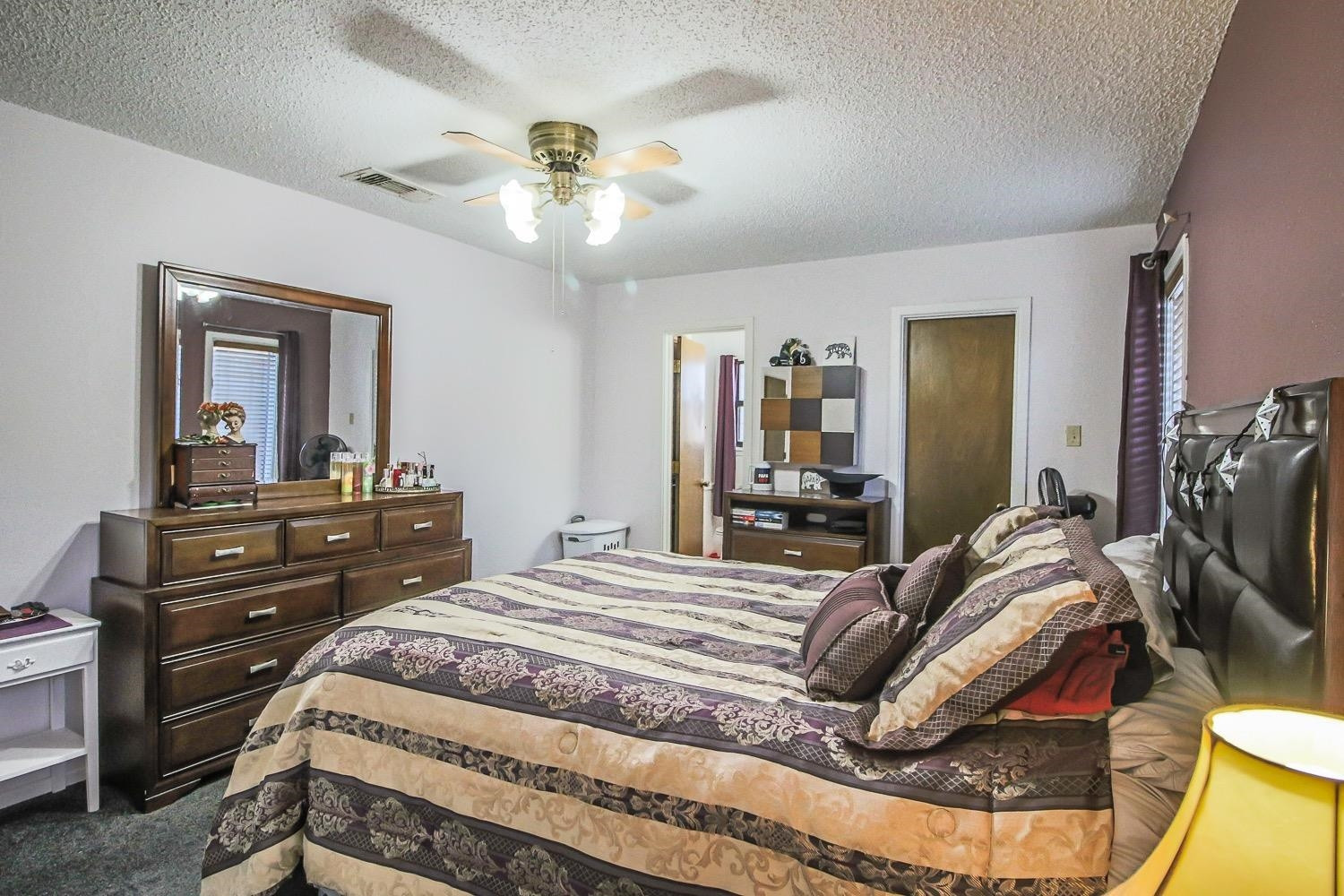 1609 Ave I Ralls, TX 79357 - Photo 15 of 32 a bedroom with a bed and a dresser