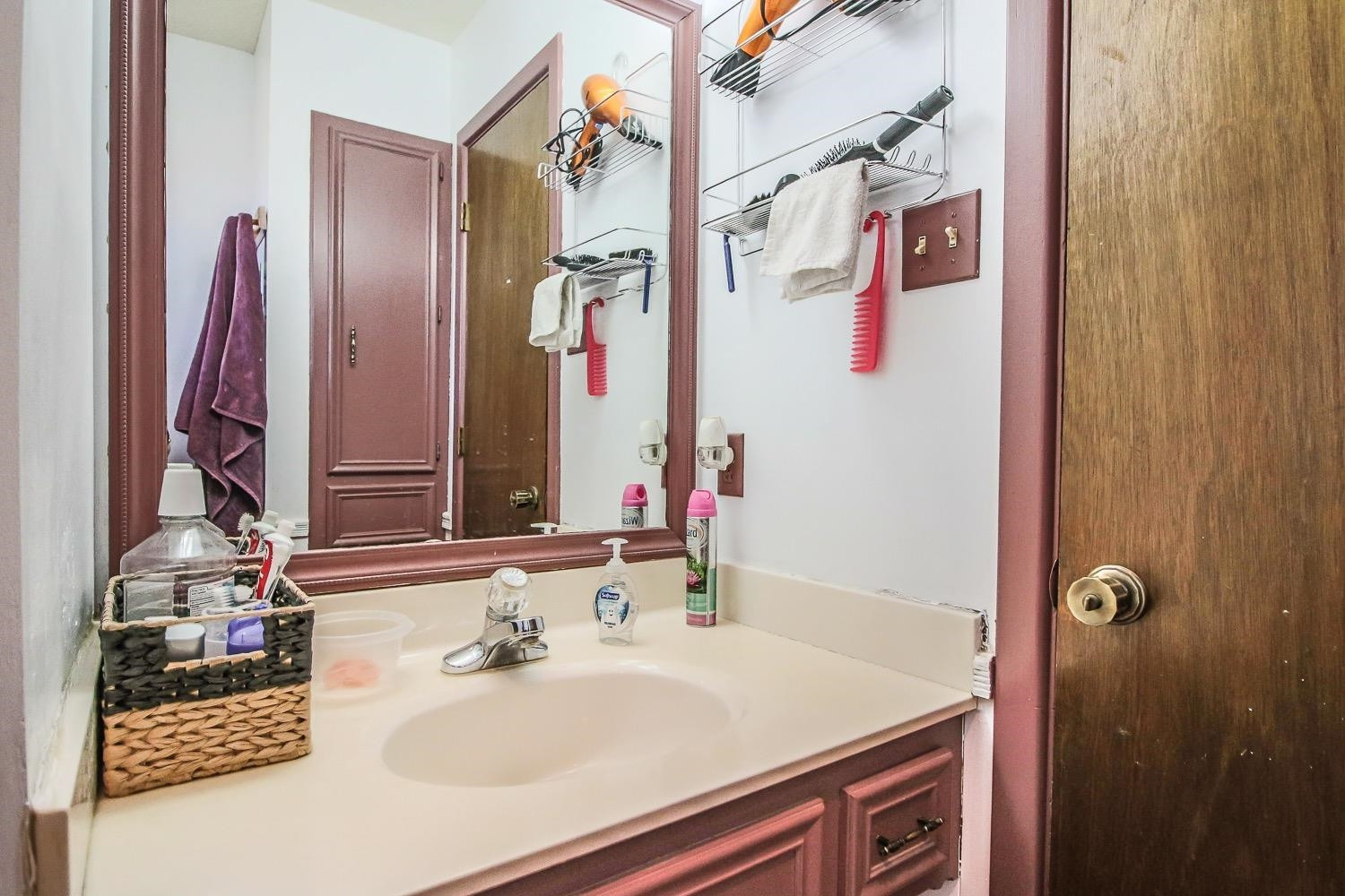 1609 Ave I Ralls, TX 79357 - Photo 17 of 32 a bathroom with a sink vanity and a mirror