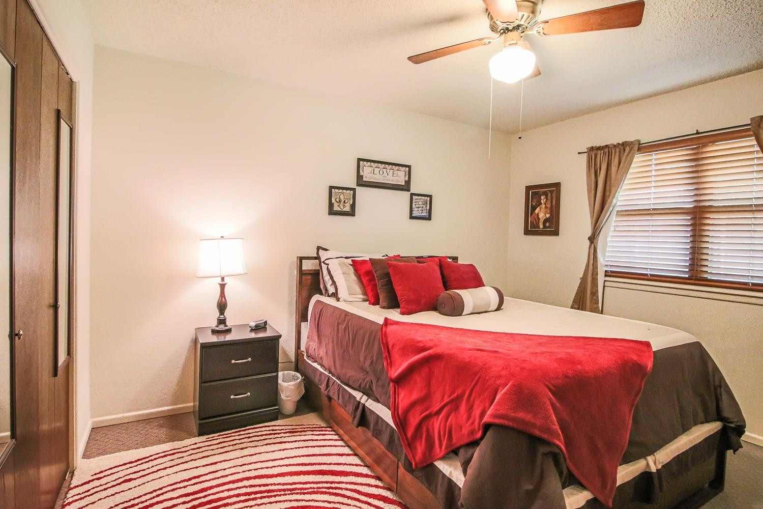 1609 Ave I Ralls, TX 79357 - Photo 20 of 32 a bedroom with a bed and wooden floor
