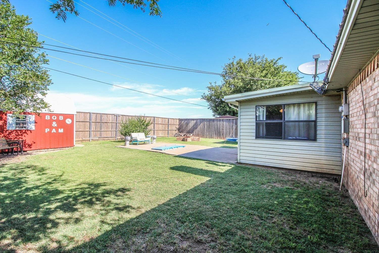 1609 Ave I Ralls, TX 79357 - Photo 26 of 32 a view of a backyard with a garden and plants