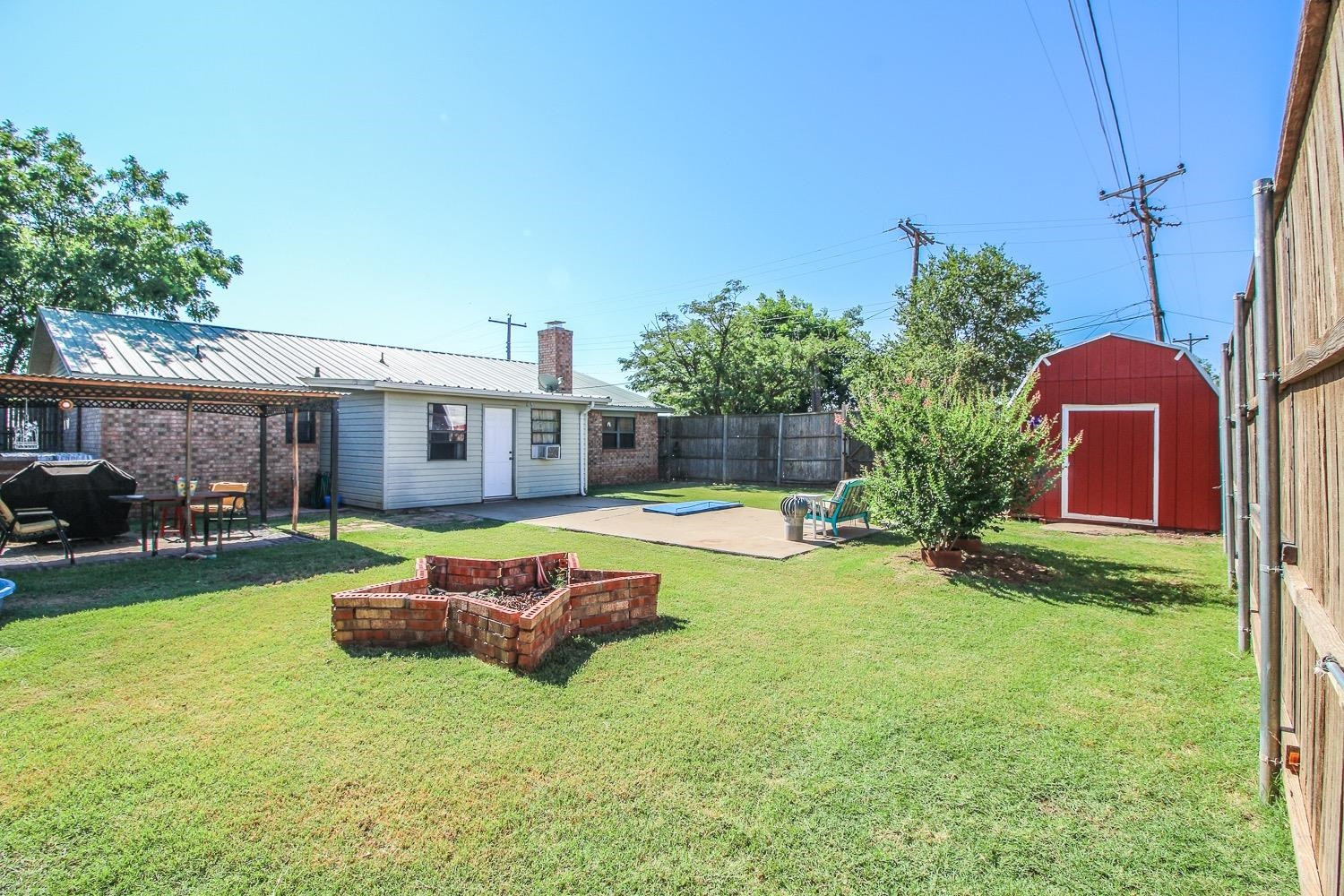 1609 Ave I Ralls, TX 79357 - Photo 27 of 32 a front view of a house with swimming pool having outdoor seating