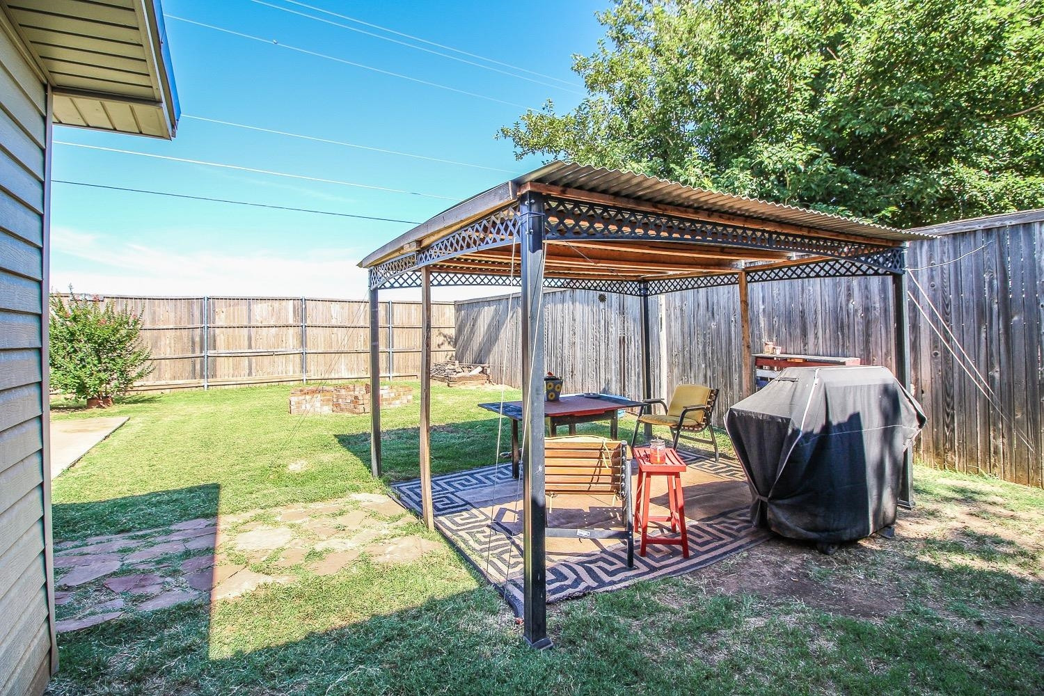 1609 Ave I Ralls, TX 79357 - Photo 28 of 32 a view of a backyard with sitting area and furniture