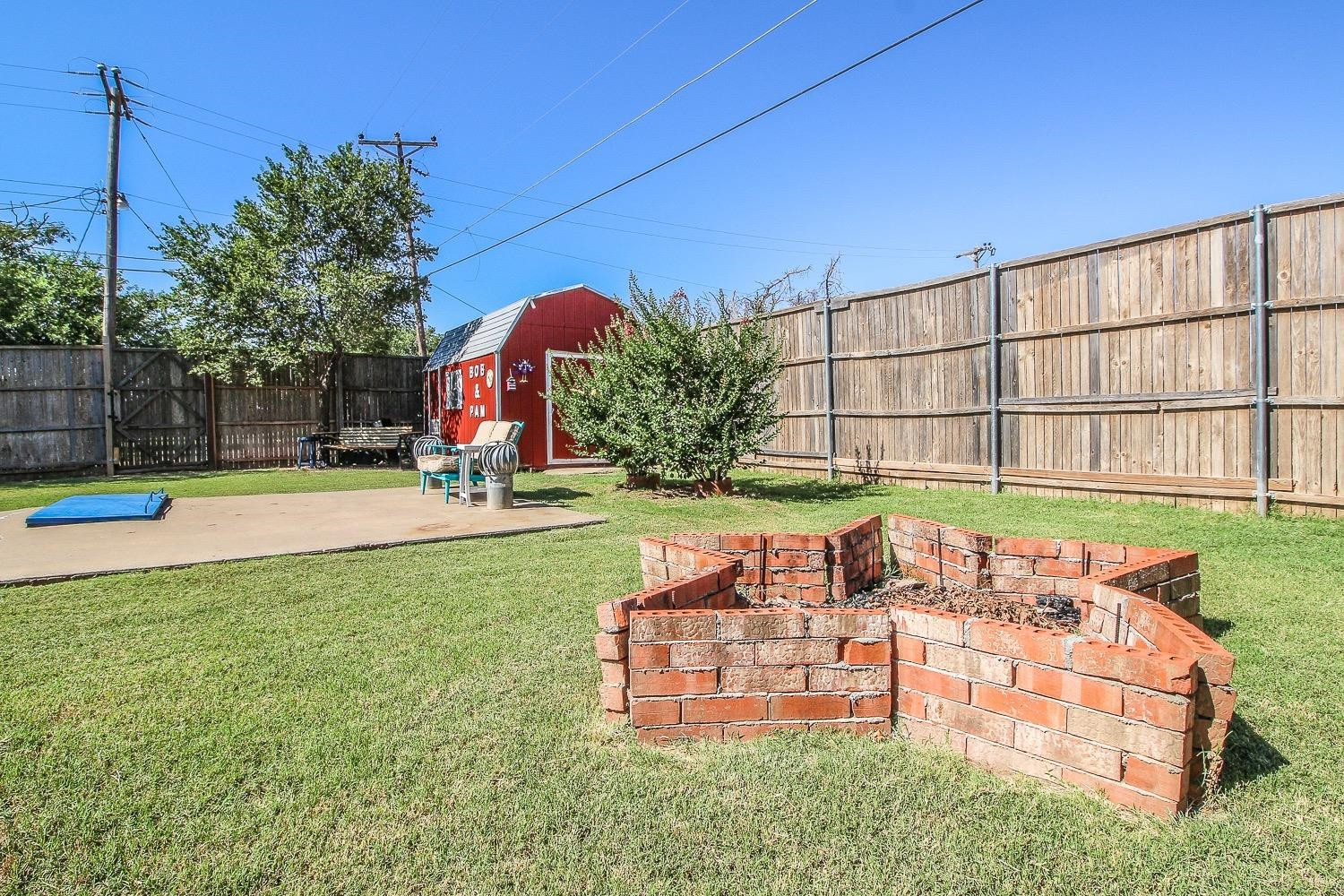 1609 Ave I Ralls, TX 79357 - Photo 29 of 32 a view of a swimming pool with a garden and seating area