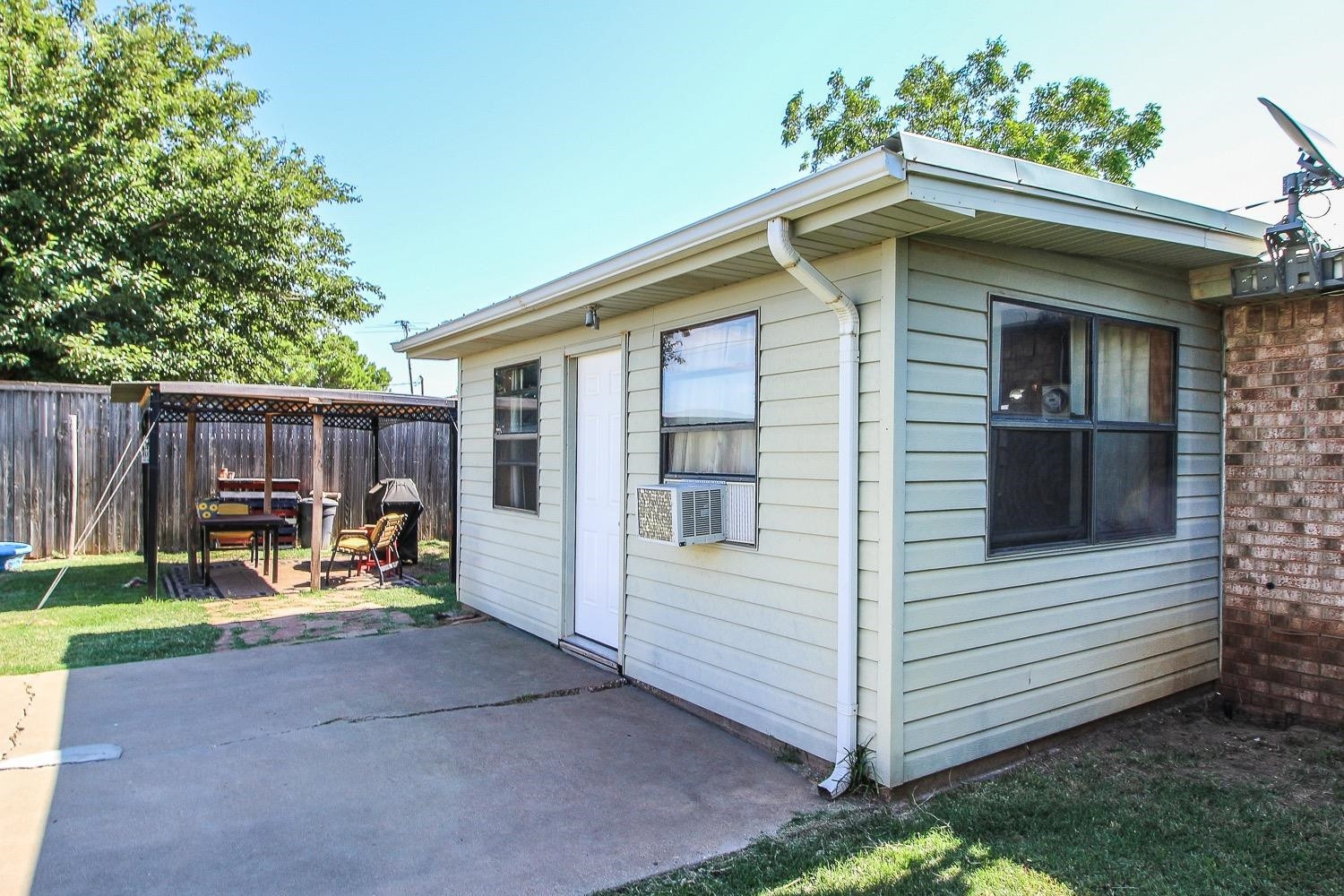 1609 Ave I Ralls, TX 79357 - Photo 31 of 32 a view of a house with a yard and furniture