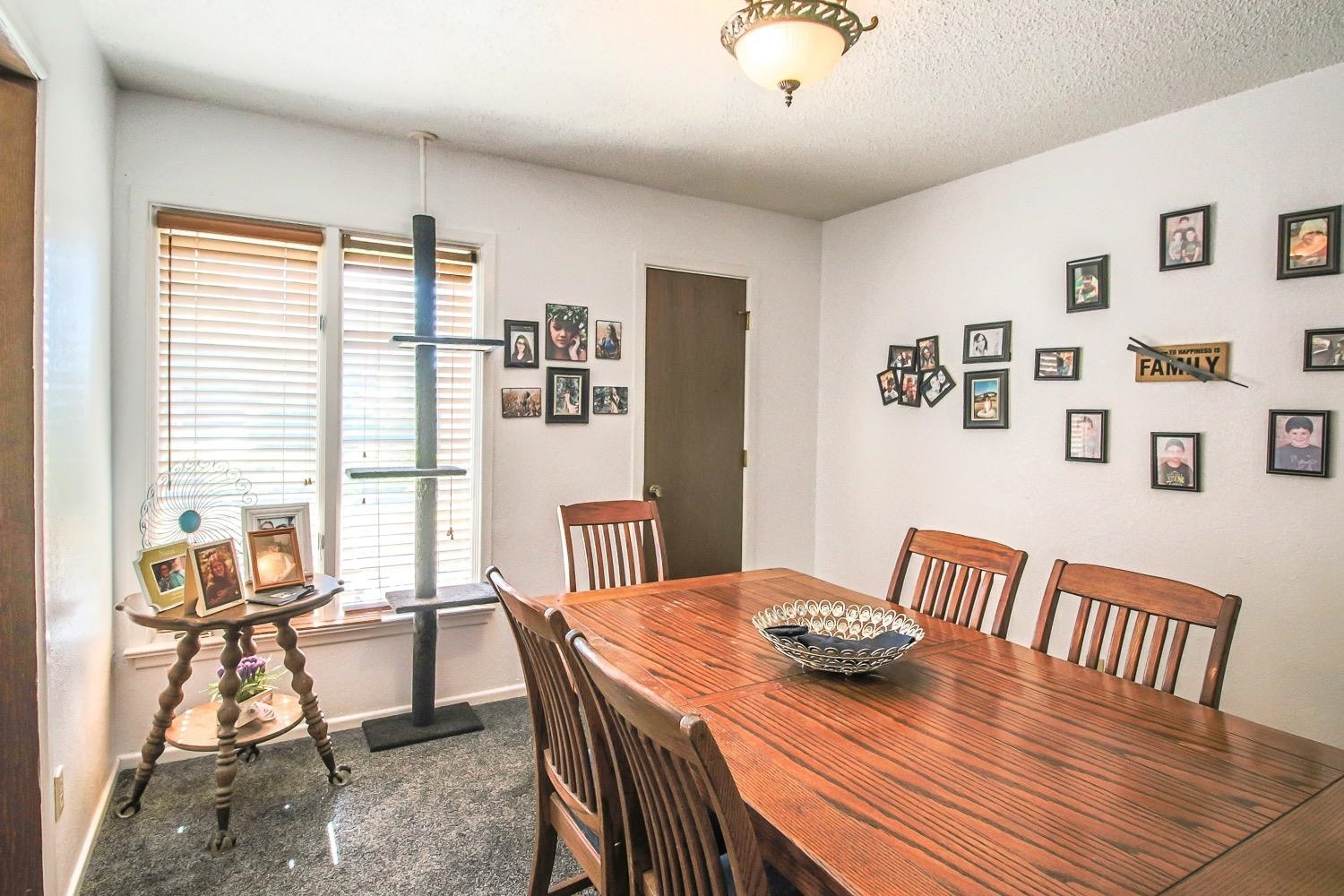 1609 Ave I Ralls, TX 79357 - Photo 5 of 32 a view of a dining room with furniture window and outside view