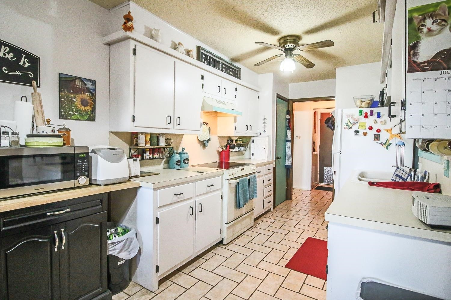 1609 Ave I Ralls, TX 79357 - Photo 10 of 32 a kitchen with a sink stove and cabinets