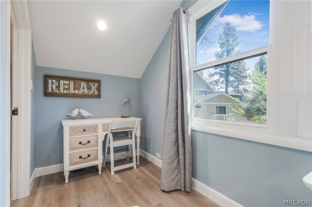 195 Elgin Road Big Bear Lake, CA 92315 - Photo 15 of 45 a view of a bedroom with furniture and a window