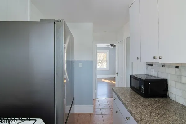 a spacious bathroom with a bathtub and a shower