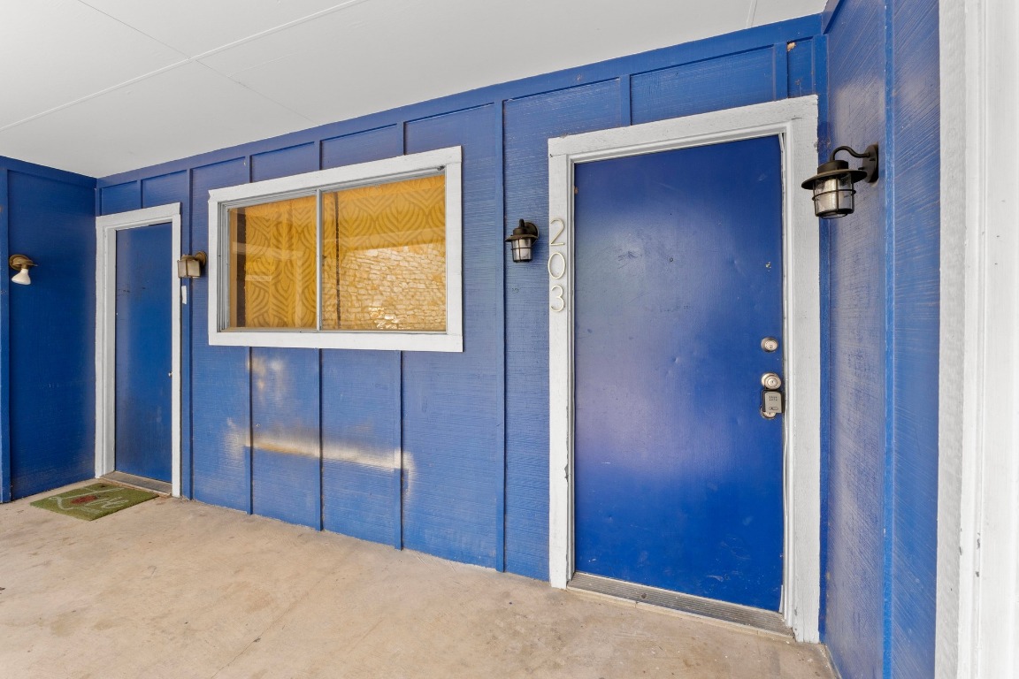 8903 Parkfield Drive, Unit 203 Austin, TX 78758 - Photo 11 of 11 a bedroom with windows and closet